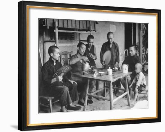 Family Having Tea in Courtyard-Carl Mydans-Framed Photographic Print