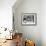 Family of Three Sitting Together Having Dinner-null-Framed Photo displayed on a wall