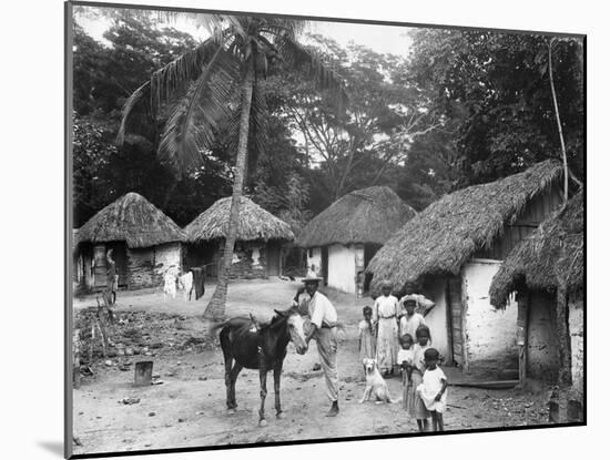 Family Outside their Home, Coolie Street, Kingston, Jamaica, 1931-null-Mounted Photographic Print