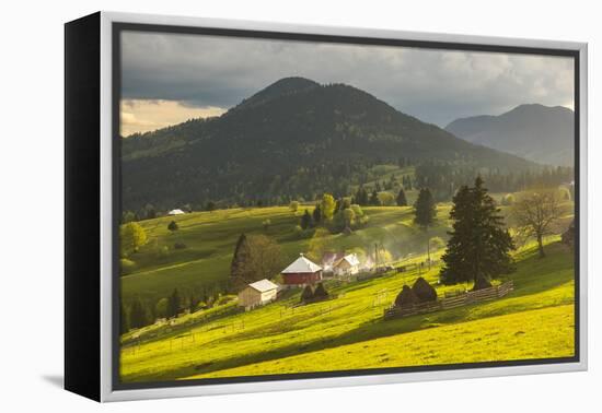 Farm and Haystacks in the Rural Transylvania Landscape at Sunset, Piatra Fantanele, Transylvania-Matthew Williams-Ellis-Framed Premier Image Canvas