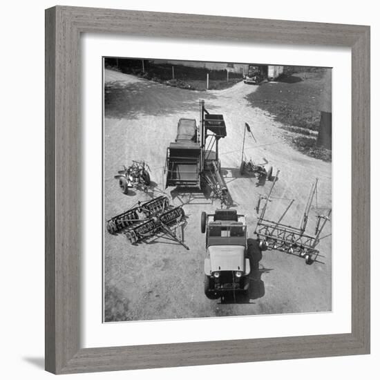 Farm Equipment Surrounding a Farmer's Jeep in Demonstration of Postwar Uses for Military Vehicles-Myron Davis-Framed Photographic Print