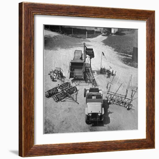 Farm Equipment Surrounding a Farmer's Jeep in Demonstration of Postwar Uses for Military Vehicles-Myron Davis-Framed Photographic Print