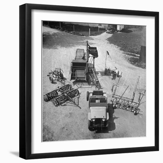 Farm Equipment Surrounding a Farmer's Jeep in Demonstration of Postwar Uses for Military Vehicles-Myron Davis-Framed Photographic Print