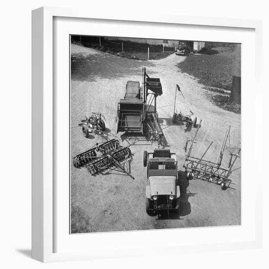 Farm Equipment Surrounding a Farmer's Jeep in Demonstration of Postwar Uses for Military Vehicles-Myron Davis-Framed Photographic Print