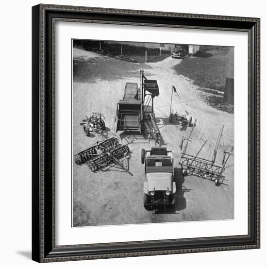 Farm Equipment Surrounding a Farmer's Jeep in Demonstration of Postwar Uses for Military Vehicles-Myron Davis-Framed Photographic Print