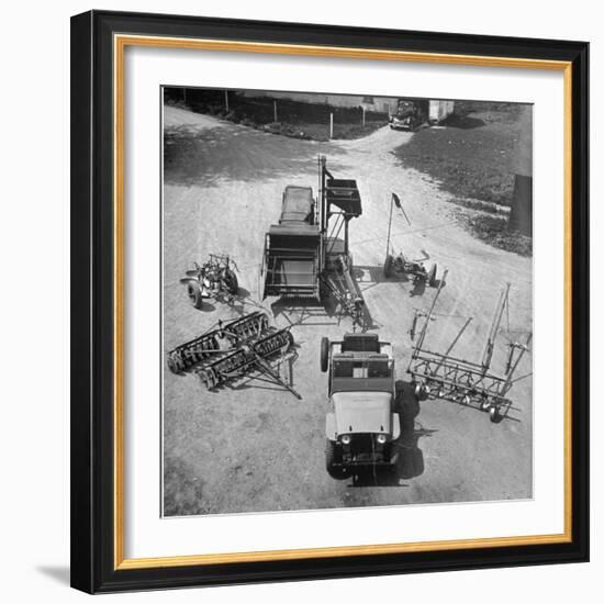 Farm Equipment Surrounding a Farmer's Jeep in Demonstration of Postwar Uses for Military Vehicles-Myron Davis-Framed Photographic Print