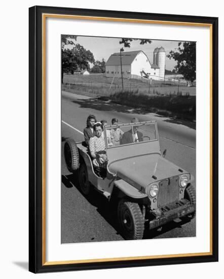 Farmer and Family Riding in a Jeep in Demonstration of Postwar Uses for Military Vehicles-null-Framed Premium Photographic Print