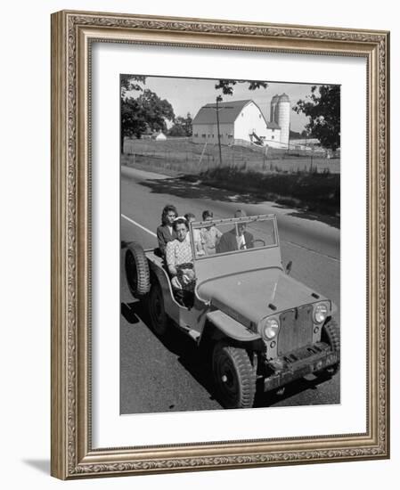 Farmer and Family Riding in a Jeep in Demonstration of Postwar Uses for Military Vehicles-null-Framed Photographic Print