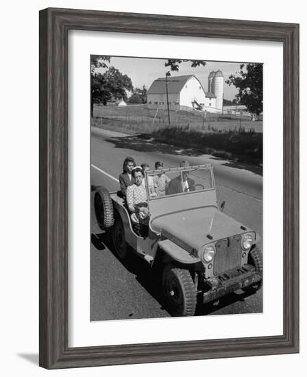 Farmer and Family Riding in a Jeep in Demonstration of Postwar Uses for Military Vehicles-null-Framed Photographic Print