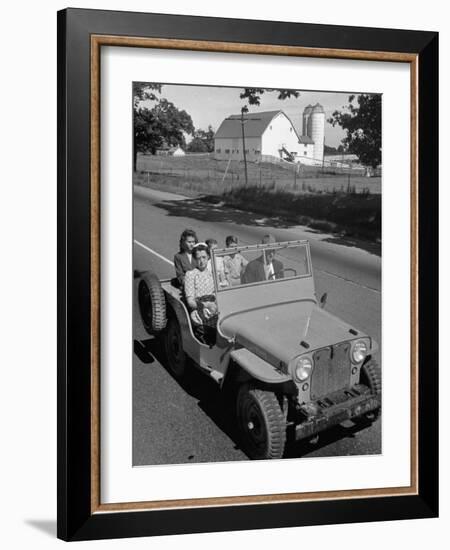 Farmer and Family Riding in a Jeep in Demonstration of Postwar Uses for Military Vehicles-null-Framed Photographic Print