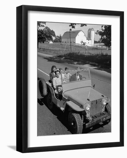 Farmer and Family Riding in a Jeep in Demonstration of Postwar Uses for Military Vehicles-null-Framed Photographic Print