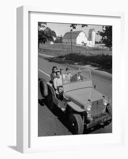 Farmer and Family Riding in a Jeep in Demonstration of Postwar Uses for Military Vehicles-null-Framed Photographic Print