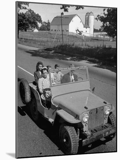 Farmer and Family Riding in a Jeep in Demonstration of Postwar Uses for Military Vehicles-null-Mounted Photographic Print