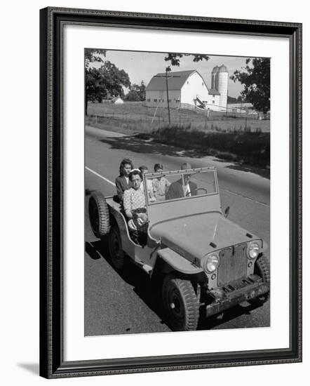 Farmer and Family Riding in a Jeep in Demonstration of Postwar Uses for Military Vehicles-null-Framed Photographic Print