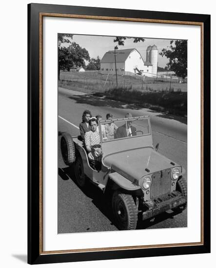 Farmer and Family Riding in a Jeep in Demonstration of Postwar Uses for Military Vehicles-null-Framed Photographic Print