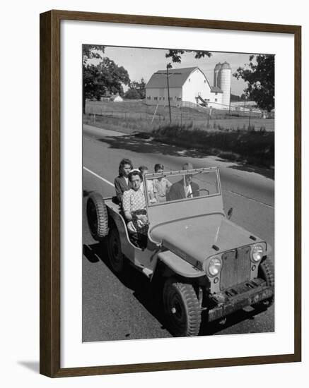 Farmer and Family Riding in a Jeep in Demonstration of Postwar Uses for Military Vehicles-null-Framed Photographic Print