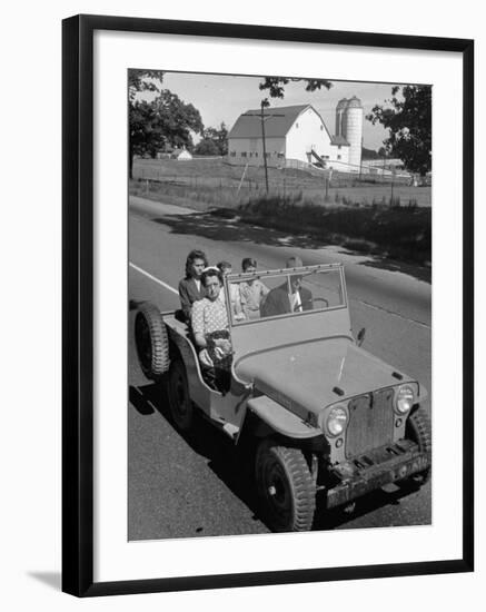 Farmer and Family Riding in a Jeep in Demonstration of Postwar Uses for Military Vehicles-null-Framed Photographic Print