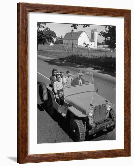 Farmer and Family Riding in a Jeep in Demonstration of Postwar Uses for Military Vehicles-null-Framed Photographic Print