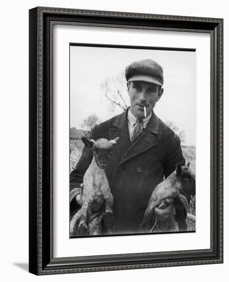 Farmer Holding His New Born Lambs in the Cotswolds-Henry Grant-Framed Photographic Print