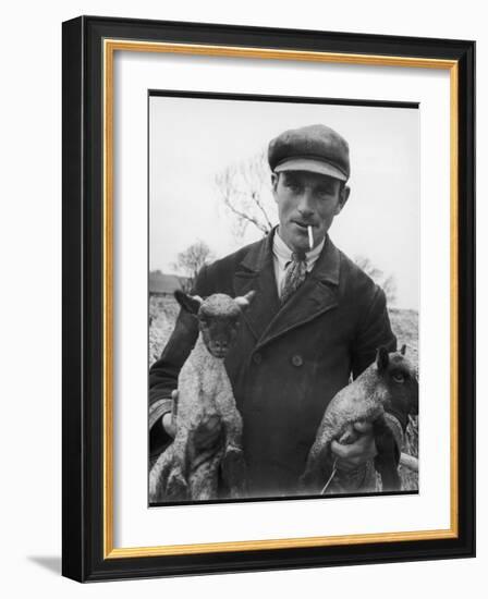 Farmer Holding His New Born Lambs in the Cotswolds-Henry Grant-Framed Photographic Print