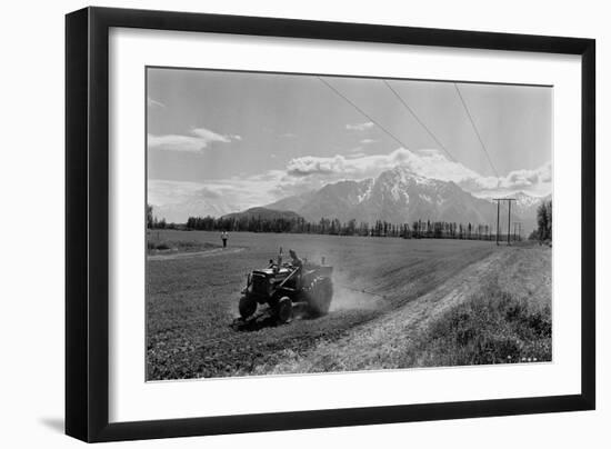 Farmer on a Tractor Spraying Insecticide on a Field before Planting in Palmer, Alaska, 1961 (Photo)-Ted Spiegel-Framed Giclee Print