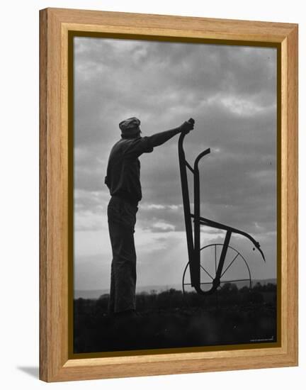 Farmer Plowing the Fields-Ed Clark-Framed Premier Image Canvas