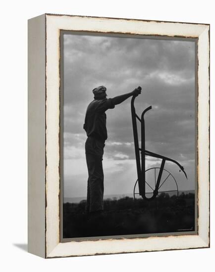 Farmer Plowing the Fields-Ed Clark-Framed Premier Image Canvas