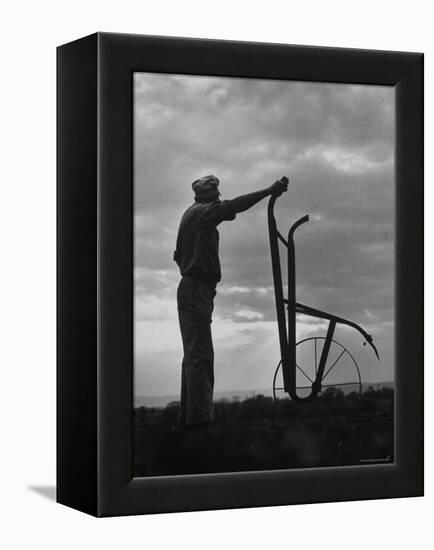 Farmer Plowing the Fields-Ed Clark-Framed Premier Image Canvas