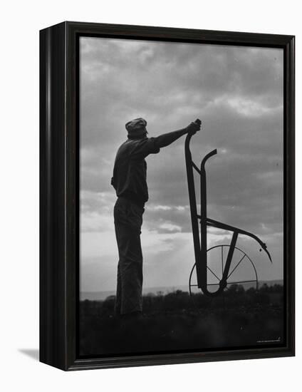 Farmer Plowing the Fields-Ed Clark-Framed Premier Image Canvas