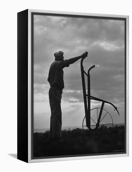 Farmer Plowing the Fields-Ed Clark-Framed Premier Image Canvas