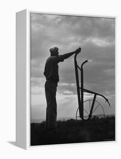 Farmer Plowing the Fields-Ed Clark-Framed Premier Image Canvas