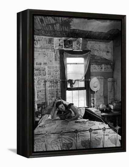 Farmer's Daughter Delphaline, Reading a Book as She Lies on Iron Bed in Her Bedroom-Alfred Eisenstaedt-Framed Premier Image Canvas
