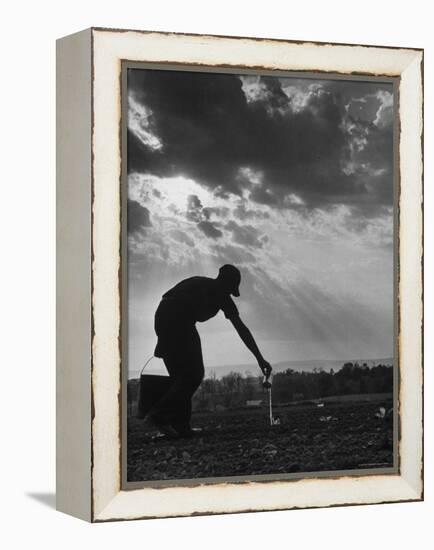 Farmer Watering the Crops-Ed Clark-Framed Premier Image Canvas