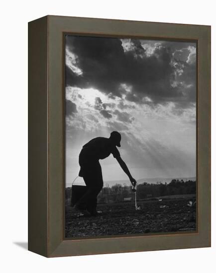 Farmer Watering the Crops-Ed Clark-Framed Premier Image Canvas