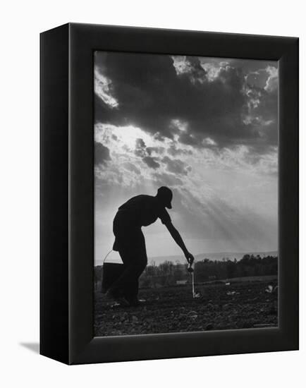 Farmer Watering the Crops-Ed Clark-Framed Premier Image Canvas