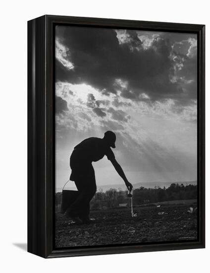 Farmer Watering the Crops-Ed Clark-Framed Premier Image Canvas