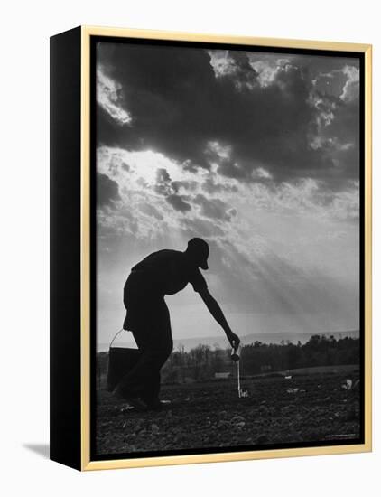 Farmer Watering the Crops-Ed Clark-Framed Premier Image Canvas