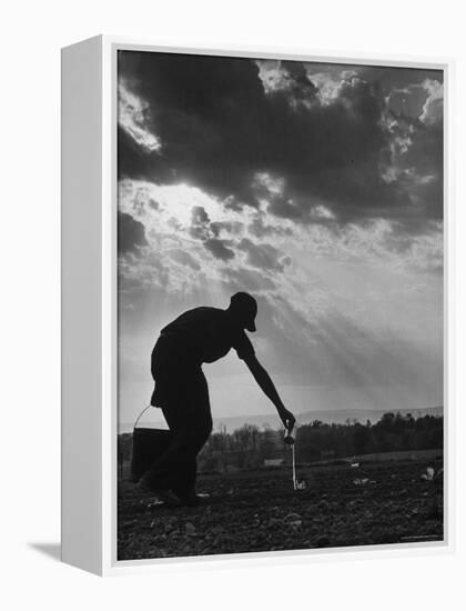 Farmer Watering the Crops-Ed Clark-Framed Premier Image Canvas