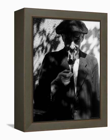 Farmer Who Has Brought His Grapes to the Hennessy and Co. Distillery Sampling Some Brandy-Gjon Mili-Framed Premier Image Canvas
