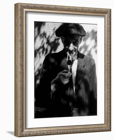 Farmer Who Has Brought His Grapes to the Hennessy and Co. Distillery Sampling Some Brandy-Gjon Mili-Framed Photographic Print