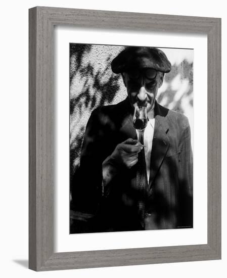 Farmer Who Has Brought His Grapes to the Hennessy and Co. Distillery Sampling Some Brandy-Gjon Mili-Framed Photographic Print