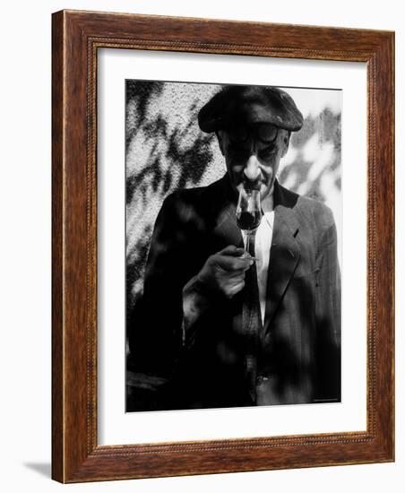 Farmer Who Has Brought His Grapes to the Hennessy and Co. Distillery Sampling Some Brandy-Gjon Mili-Framed Photographic Print