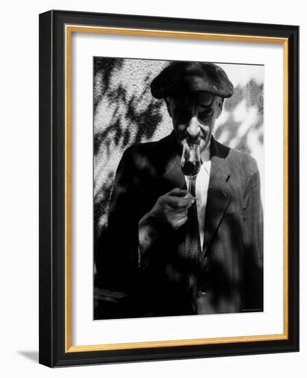 Farmer Who Has Brought His Grapes to the Hennessy and Co. Distillery Sampling Some Brandy-Gjon Mili-Framed Photographic Print