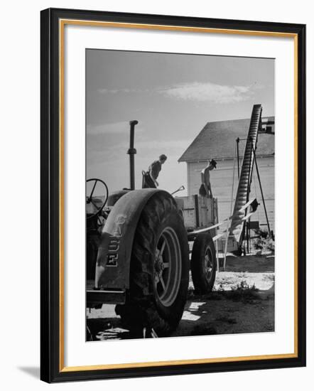 Farmers Storing their Grain-null-Framed Premium Photographic Print