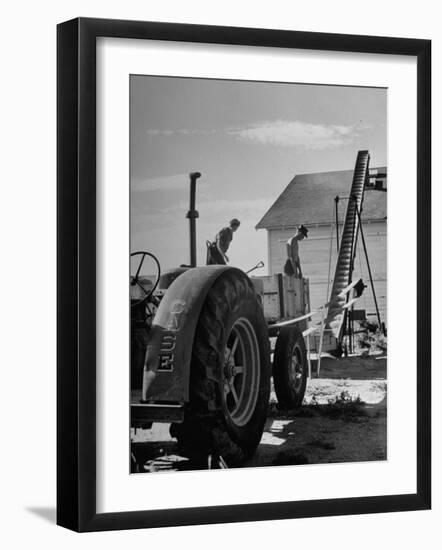 Farmers Storing their Grain-null-Framed Photographic Print