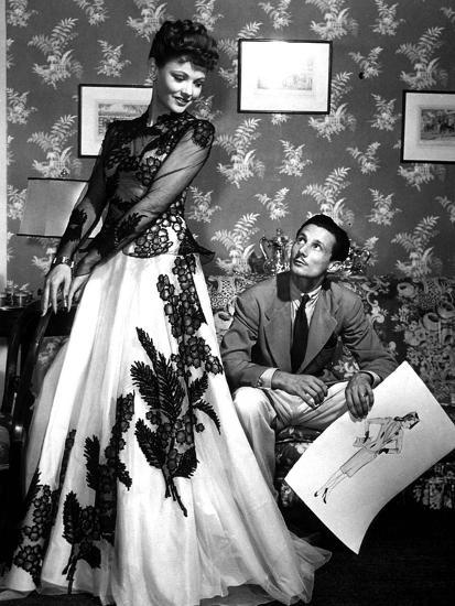 Fashion Designer Oleg Cassini Showing His Drawings to Gene Tierney to Show Her the Clothes in 1941 Photo | Art.com Fashion Designer Oleg Cassini Showing His Drawings to Gene Tierney to Show Her the Clothes in 1941 Photo | Art.com