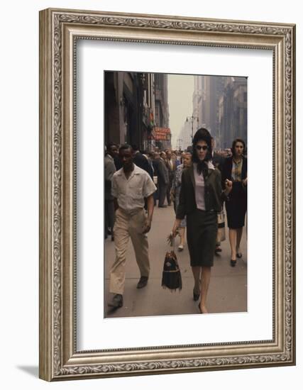 Fashion Model Brigitte Wasserman Walks Along 7th Avenue, New York, New York, 1960-Walter Sanders-Framed Photographic Print