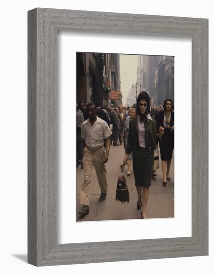 Fashion Model Brigitte Wasserman Walks Along 7th Avenue, New York, New York, 1960-Walter Sanders-Framed Photographic Print
