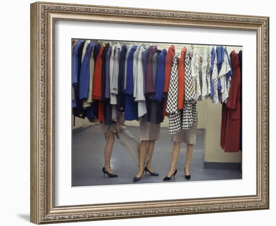 Fashion Models Behind a Suit Rack Trying on Clothes at Zelinka-Matlick, New York, New York, 1960-Walter Sanders-Framed Photographic Print