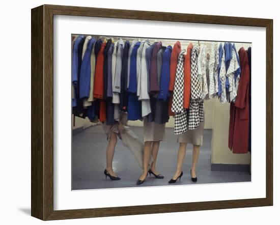 Fashion Models Behind a Suit Rack Trying on Clothes at Zelinka-Matlick, New York, New York, 1960-Walter Sanders-Framed Photographic Print